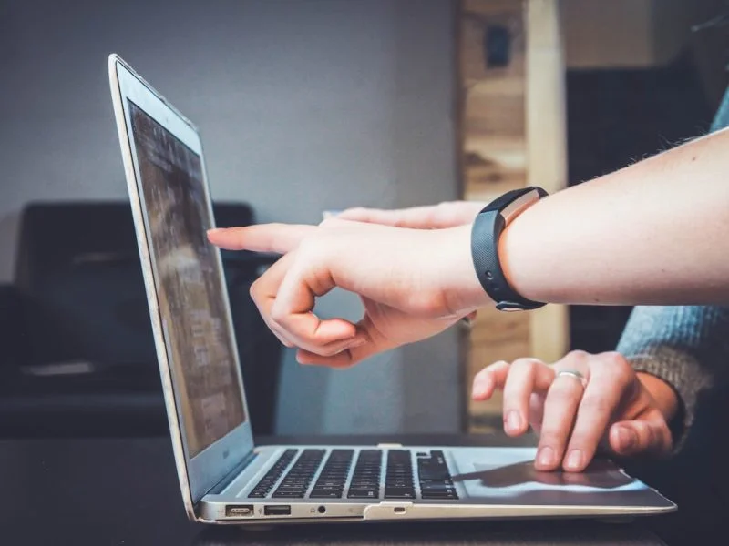 Person analysing website performance and bounce rate on laptop