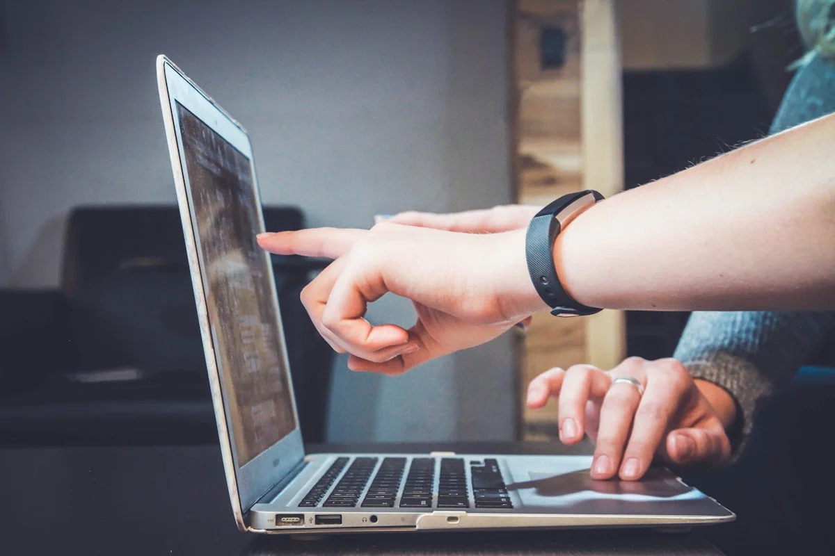 Person analysing website performance and bounce rate on laptop