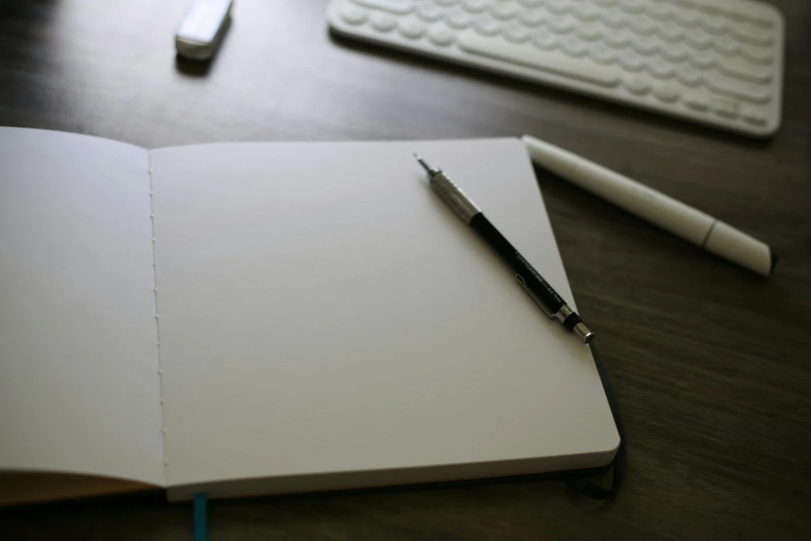 Open notebook and keyboard representing conversion copywriting