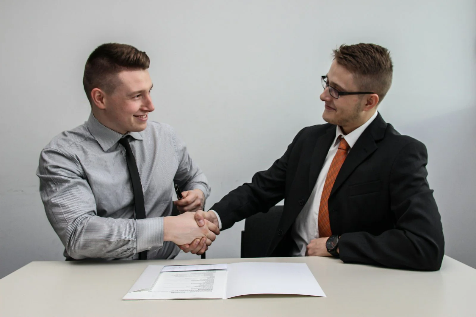 Business handshake representing trust signals on a website