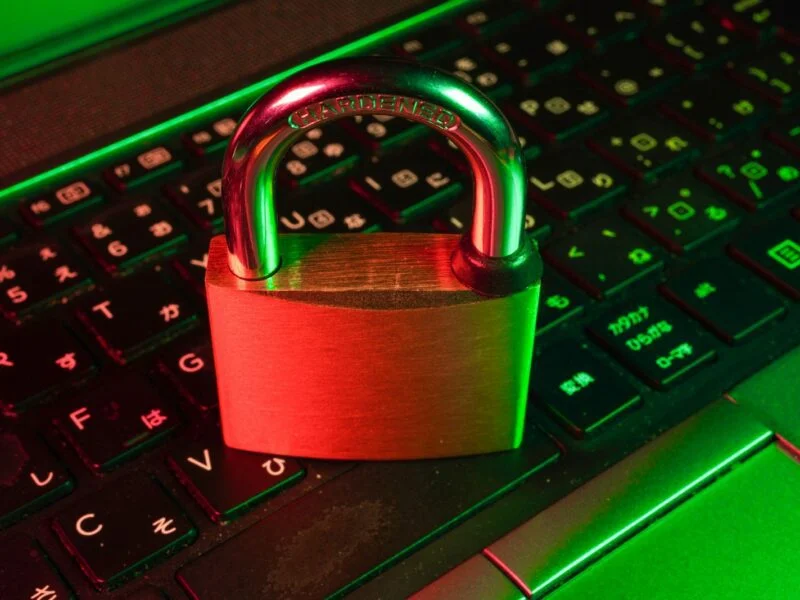 Red padlock on a keyboard representing WordPress security for small businesses