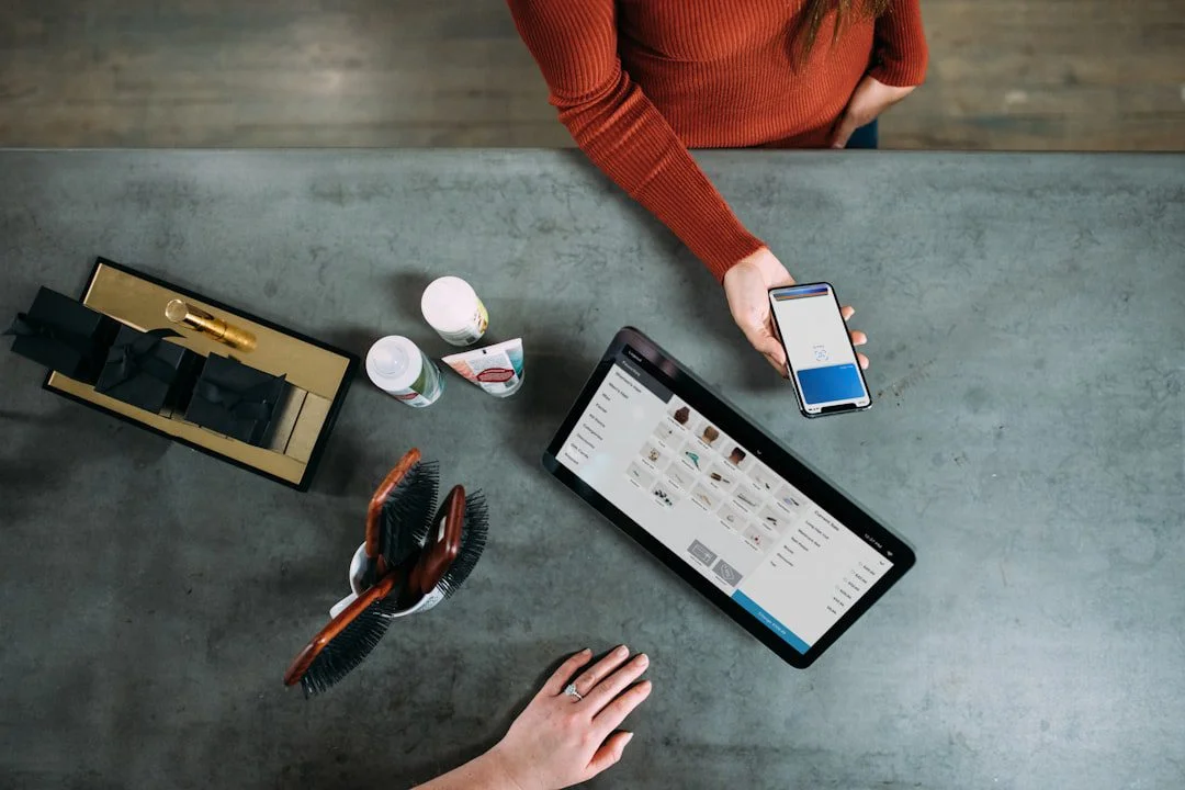 Shopper holding a phone with an online cart open, hesitating before completing a purchase