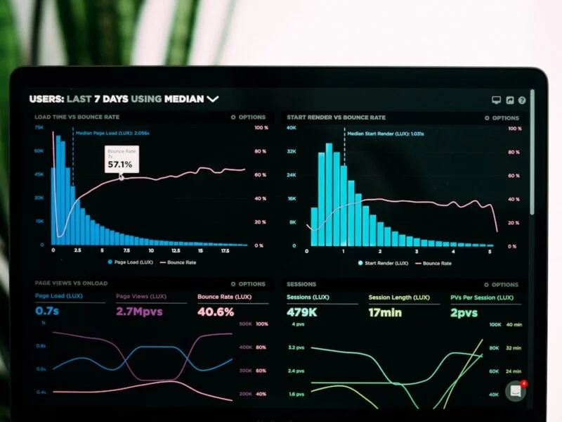 Small business owner checking website technical health metrics on a laptop dashboard