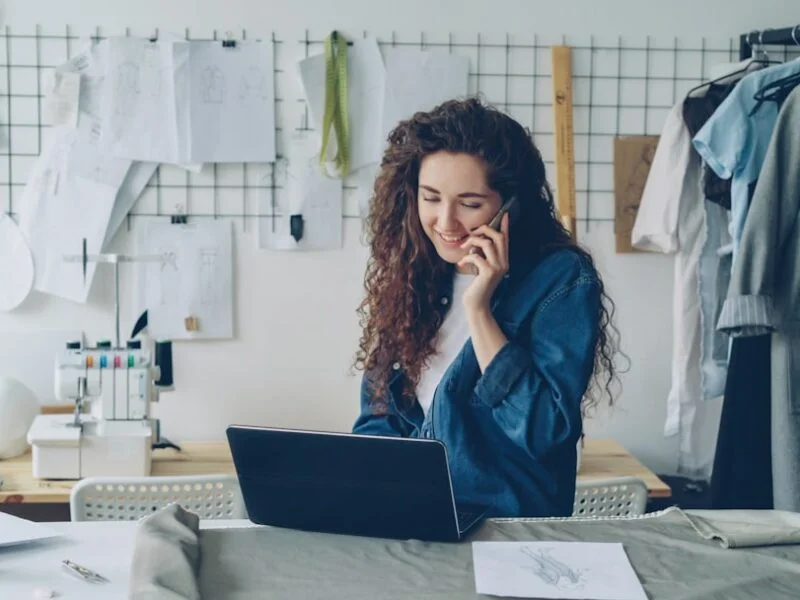 A small business owner reviewing website analytics on a laptop at a desk