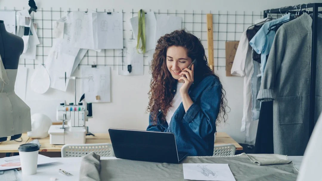 A small business owner reviewing website analytics on a laptop at a desk