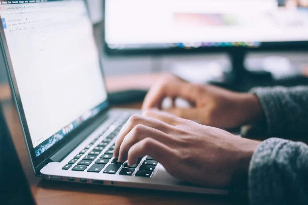 A person browsing a website using only the keyboard on a laptop in natural light