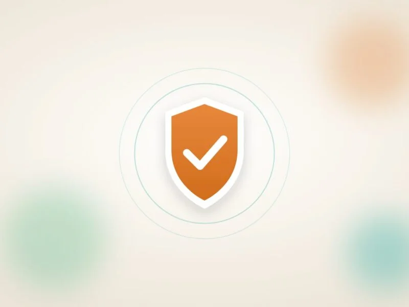 A shield with a tick on a soft cream background