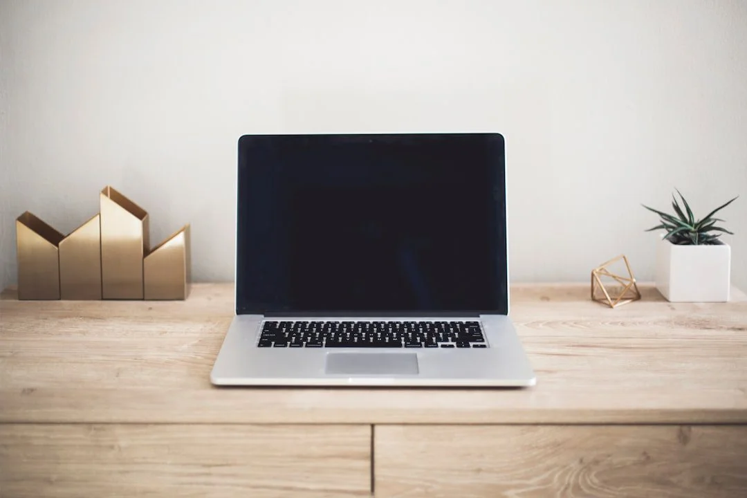 A web designer working through a pre-launch website checklist on a laptop before going live