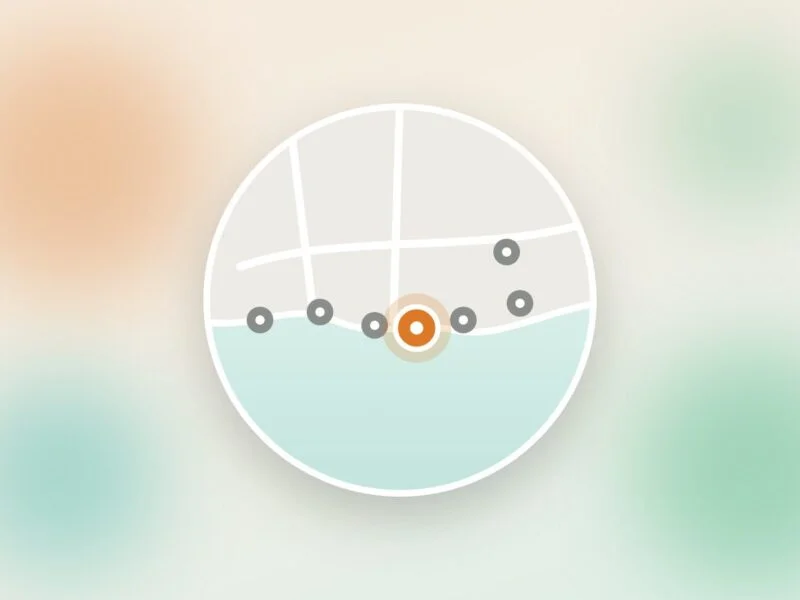 A round map of a stretch of coastline with seven location markers along the shore, one highlighted in orange.